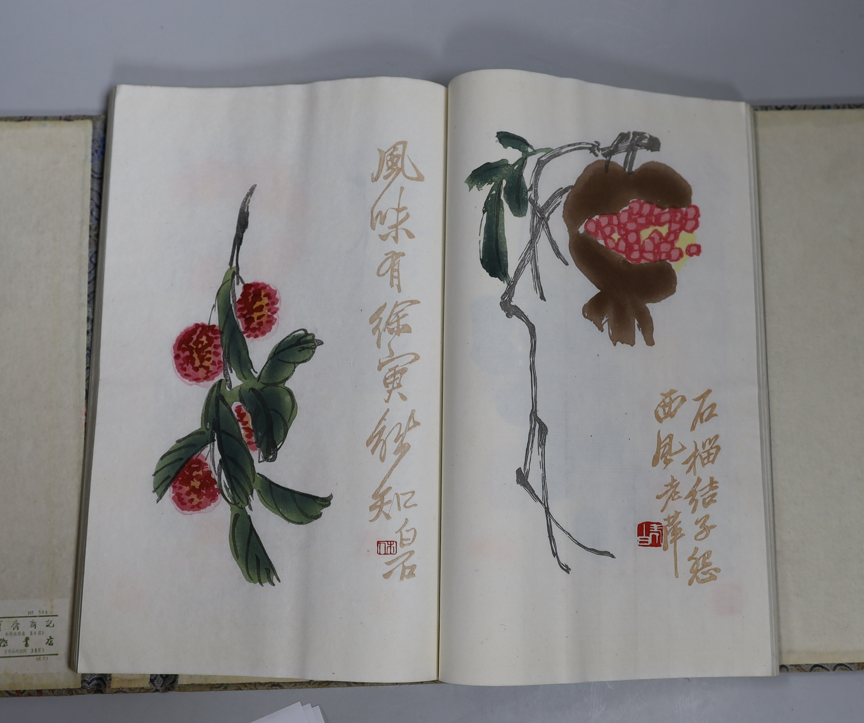 A Chinese book of woodblock prints of works by famous artists including Qi Baishi, published by Rongbao Ji, Beijing 1952